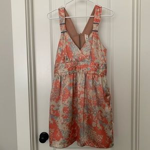 Orange and cream mosaic back cut out dress.